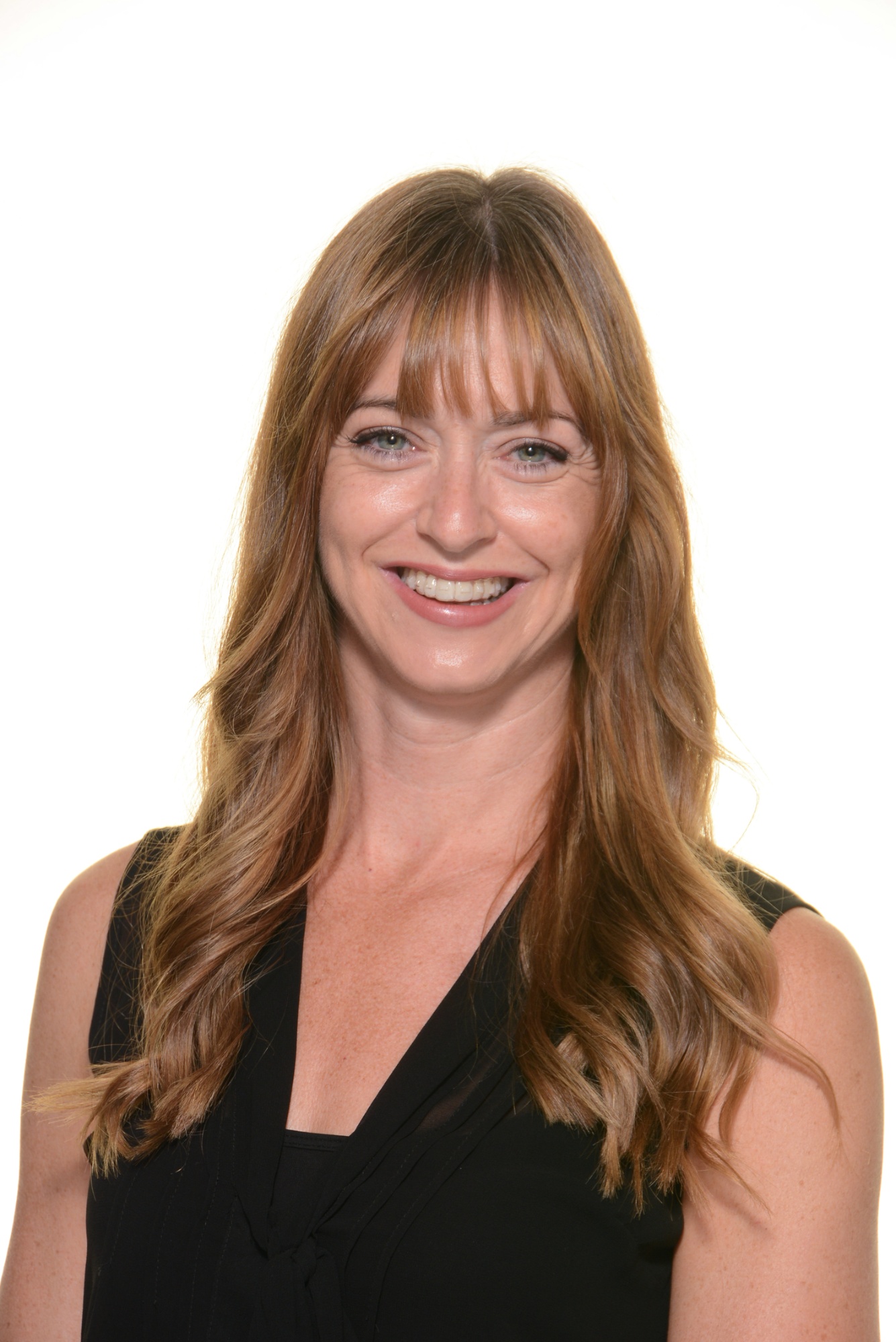 Mrs T Grosvenor, Assistant Headteacher at Penkridge Middle School, smiling in a black sleeveless top